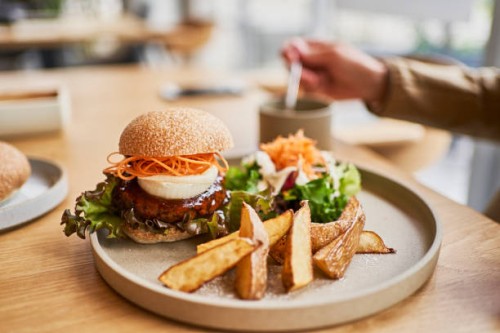 vegan cafe's veggie burger lunch plate. - food stock pictures, royalty-free photos & images