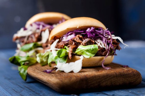 vegan jackfruit jurger with red cabbage, white cabbage, lamb's lettuce - food stock pictures, royalty-free photos & images