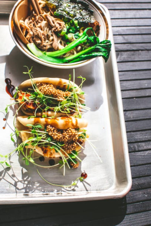 vegan steamed bao buns and ramen - junk food stock pictures, royalty-free photos & images