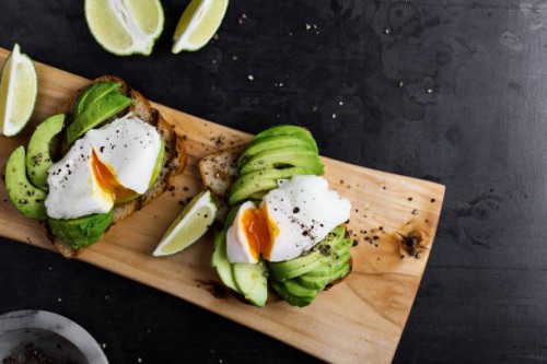 vegetarian sandwiches with poached egg and sliced avocado - food stock pictures, royalty-free photos & images