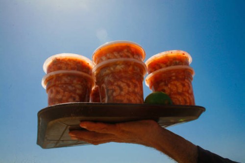 Vendor offers a seafood cocktail locally called Seven Powers amidst the Coronavirus pandemic in La Guaira, Venezuela on September 18, 2021.