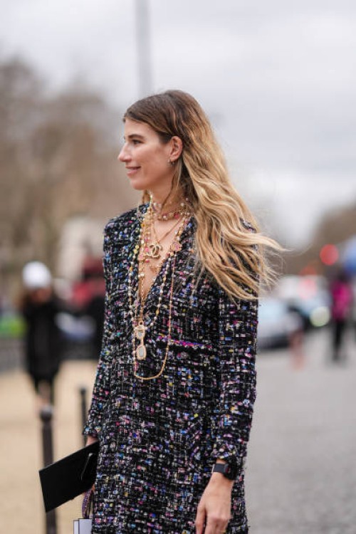 Veronika Heilbrunner wears a tweed colored jacket, Chanel necklaces, outside Chanel, during the Womenswear Fall/Winter 2024/2025 as part of Paris...