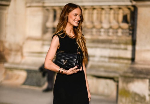Victoria Magrath is seen wearing a black Louis Vuitton dressand black Louis Vuitton bag outside the Louis Vuitton show during Womenswear...