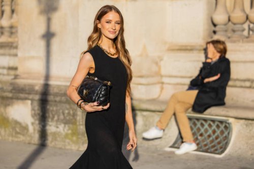 Victoria Magrath wears black dress, bag outside Louis Vuitton during Womenswear Spring/Summer 2025 as part of Paris Fashion Week on October 01, 2024...