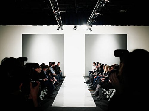 view down catwalk of photographers and crowd - fashion week stock pictures, royalty-free photos & images