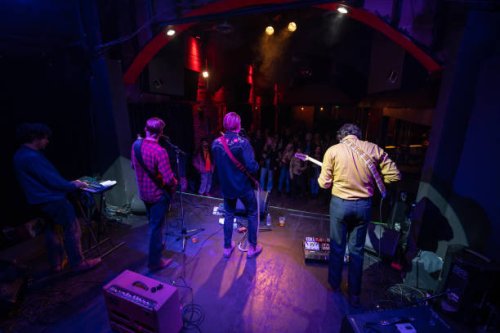 view of band performing to audience from back of stage - concert stock pictures, royalty-free photos & images