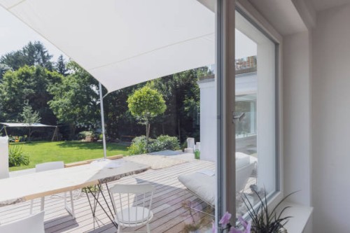 view outside a window into the garden and terrace. - garden decoration stock pictures, royalty-free photos & images