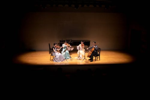 violinists and cellist playing at classical music concert - concert stock pictures, royalty-free photos & images