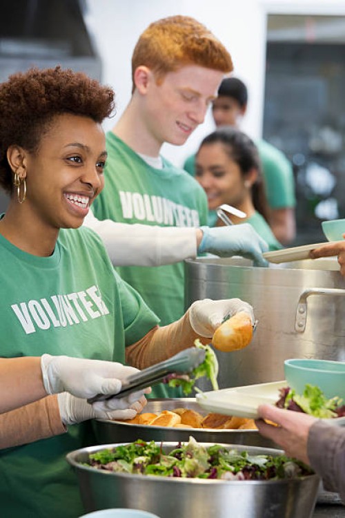 volunteers working in soup kitchen - food stock pictures, royalty-free photos & images