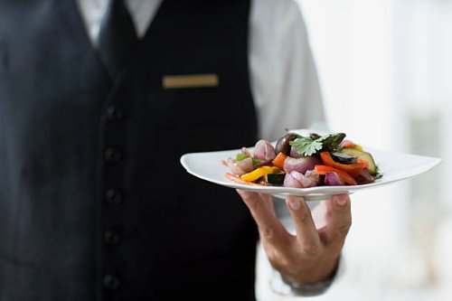 waiter holding plate - food stock pictures, royalty-free photos & images