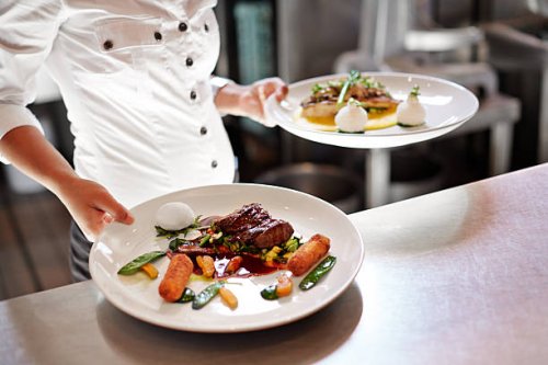 waiter picking up dishes in kitchen at restaurant - food stock pictures, royalty-free photos & images