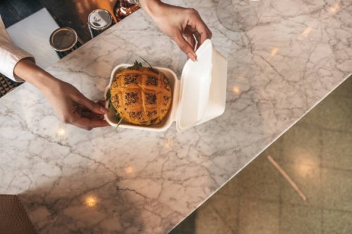 waiter preparing food delivery boxes - junk food stock pictures, royalty-free photos & images