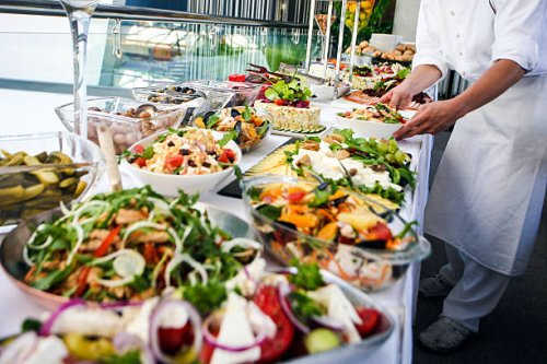 waiter serving a buffet table - food stock pictures, royalty-free photos & images