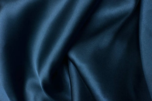 wavy folds of grunge blue silk texture satin velvet material or luxurious blue silk as background, folds of blue silky fabric. - fashion stock-fotos und bilder