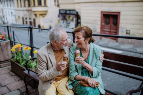 well dressed senior couple dating together in city centre, old town. - travel stock pictures, royalty-free photos & images