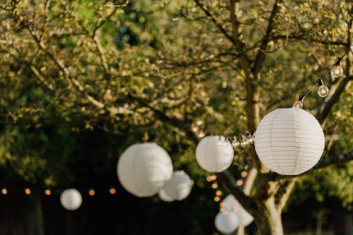 white lanters on a wedding in a garden - garden decoration stock pictures, royalty-free photos & images