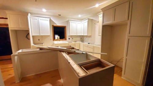 white shaker cabinets installed in kitchen under renovation - home decoration stock pictures, royalty-free photos & images
