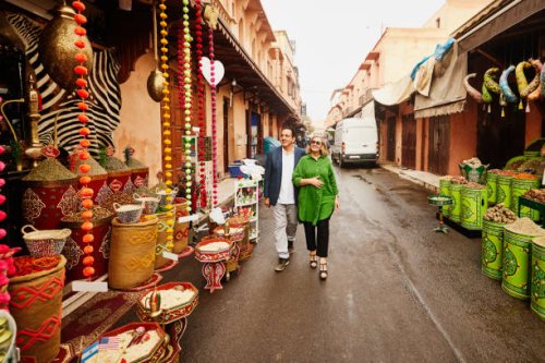 wide shot of senior couple admiring spice shops in the medina of marrakech - travel stock pictures, royalty-free photos & images