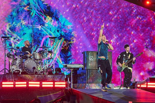 Will Champion, Chris Martin, and Guy Berryman of Coldplay perform at Rogers Stadium on July 07, 2025 in Toronto, Ontario.