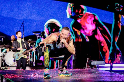 Will Champion, Guy Berryman and Chris Martin of Coldplay perform at Stadio San Siro, on June 25, 2023 in Milan, Italy.