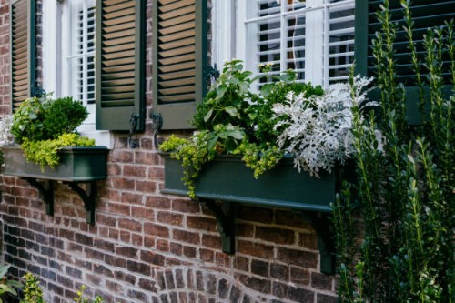 window boxes adorn house exterior - garden decoration stock pictures, royalty-free photos & images