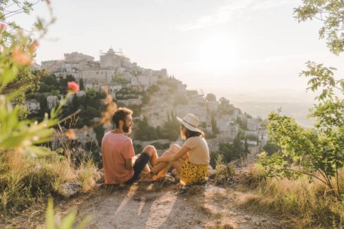 woman and man looking at scenic view of gordes village in provence - travel stock pictures, royalty-free photos & images
