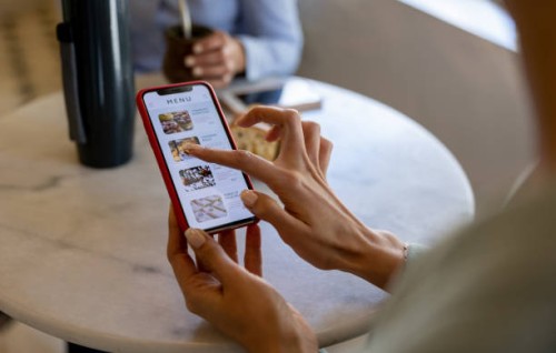 woman at a cafe looking at a digital menu - food stock pictures, royalty-free photos & images