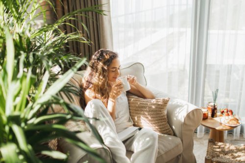 woman at home reading book and drinking coffee. - coffee stock pictures, royalty-free photos & images