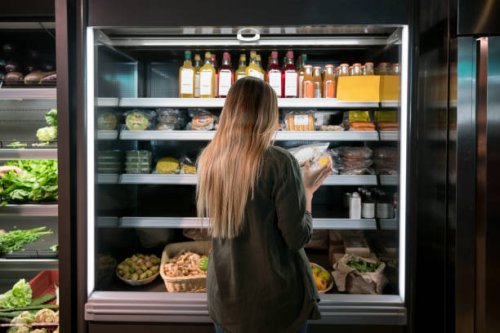 woman buying food at the supermarket - food stock pictures, royalty-free photos & images