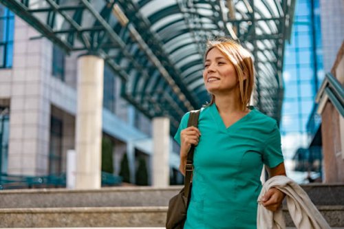 woman caregiver outdoors on the way to work - travel stock pictures, royalty-free photos & images