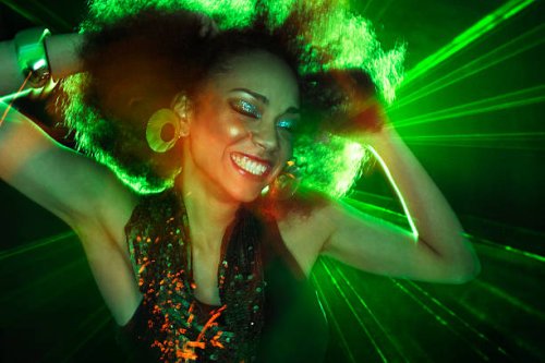 woman dancing in front of green laser - hairstyle stock pictures, royalty-free photos & images