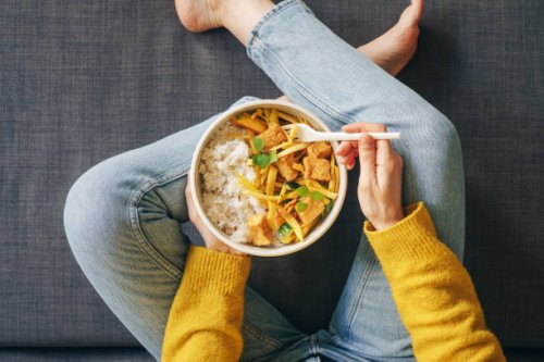 woman eating rice with tofu for lunch - junk food stock pictures, royalty-free photos & images