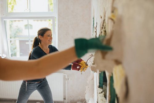 woman enjoying demolition. - home decoration stock pictures, royalty-free photos & images