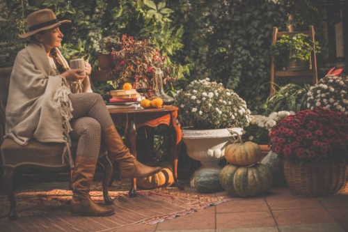 woman enjoying sunny day in back yard - garden decoration stock pictures, royalty-free photos & images