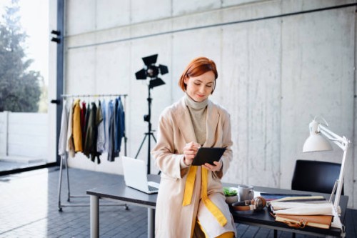 woman entrepreneur designer with tablet, working. - fashion stock pictures, royalty-free photos & images