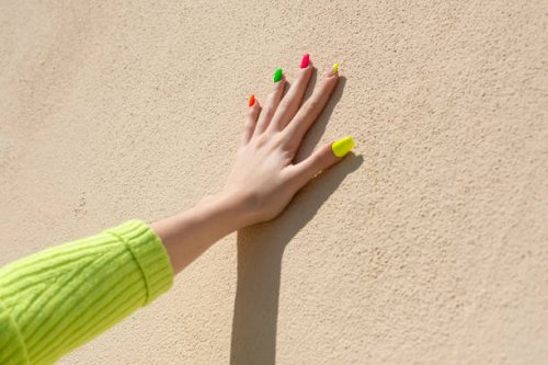 woman fingers with multicolor nail art manicure - nails art stock pictures, royalty-free photos & images