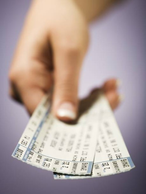 woman giving tickets - concert stock pictures, royalty-free photos & images