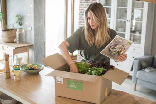 woman got package from meal delivery service. - food stock pictures, royalty-free photos & images