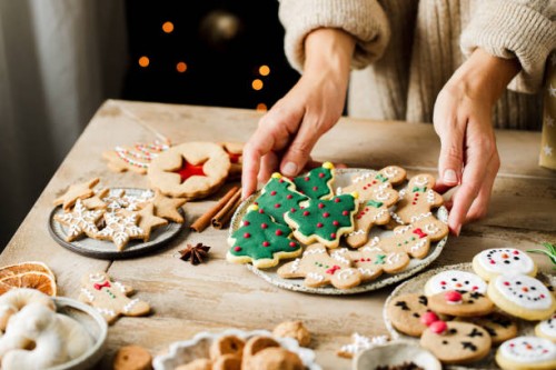 woman hands arranging sweets on christmas table - food stock pictures, royalty-free photos & images