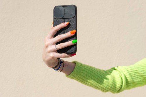 woman hands holding smart phone outdoors - fashion stock pictures, royalty-free photos & images