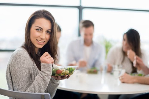 woman having dinner with friends - junk food stock pictures, royalty-free photos & images