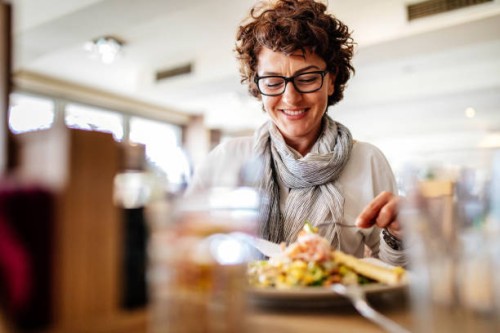 woman having lunch at a restaurant - food stock pictures, royalty-free photos & images