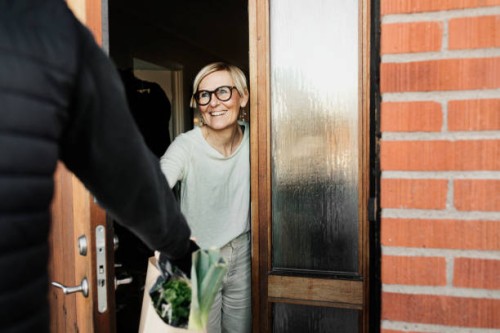 woman having shopping delivered - food stock pictures, royalty-free photos & images