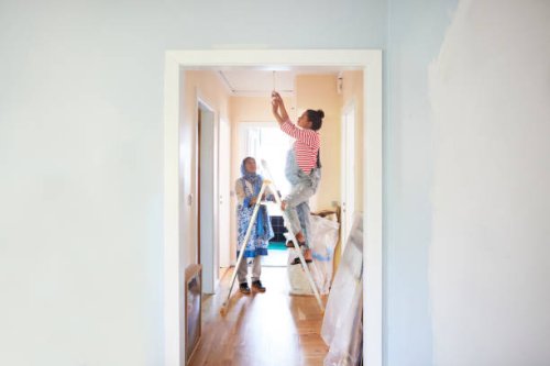 woman helping daughter-in-law in home renovation - home decoration stock pictures, royalty-free photos & images