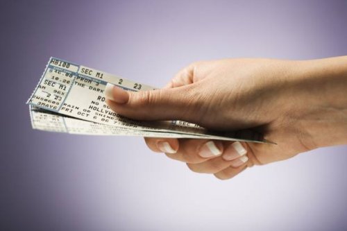 woman holding concert tickets - concert stock pictures, royalty-free photos & images