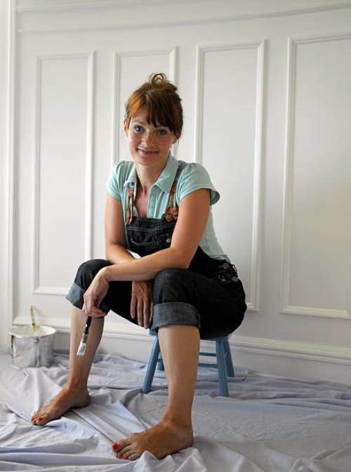 woman holding paint brush - home decoration stock pictures, royalty-free photos & images