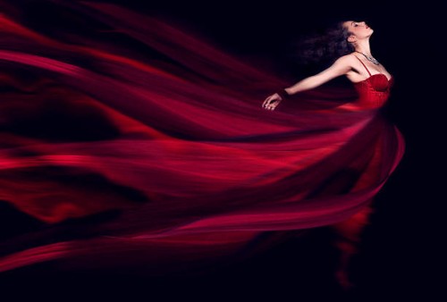 woman in a long red flowing dress - fashion stock pictures, royalty-free photos & images