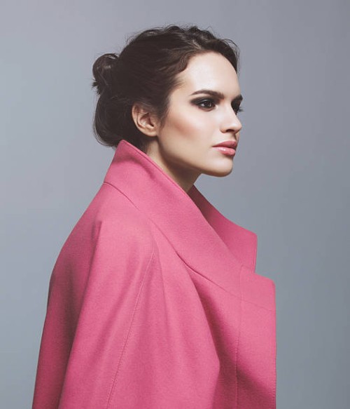 woman in pink coat - fashion stock pictures, royalty-free photos & images