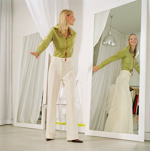 woman in store fitting room - fashion stock pictures, royalty-free photos & images