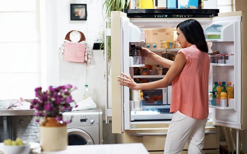 woman looking in the fridge - food stock pictures, royalty-free photos & images